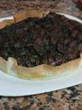 Quiche de morcilla con uva y espinacas