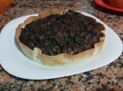 Una foto de espinacas con morcilla