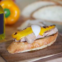 Tuna in olive oil, peppers and sweet onions on toast A picture of Tuna in olive oil, peppers and sweet onions on toast.