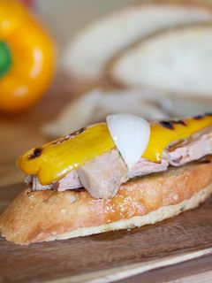 A picture of Tuna in olive oil, peppers and sweet onions on toast.
