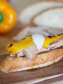 A picture of Tuna in olive oil, peppers and sweet onions on toast.