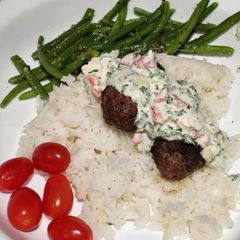 A picture of Beef "Koftas" with a ranch-style Dip.