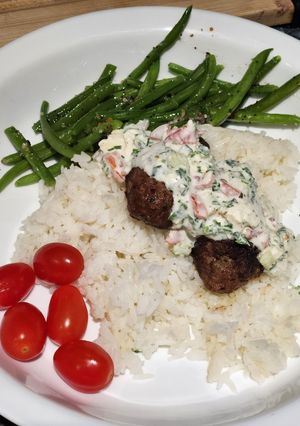A picture of Beef "Koftas" with a ranch-style Dip.