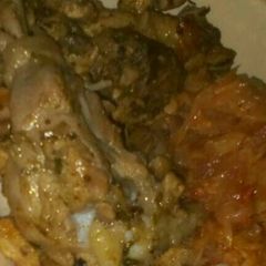 A picture of Pan fried chicken with fried cabbages.