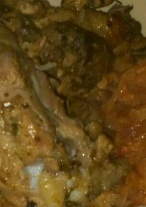 A picture of Pan fried chicken with fried cabbages.