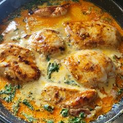 A picture of Paprika chicken in a creamy sauce with cubed potatoes.