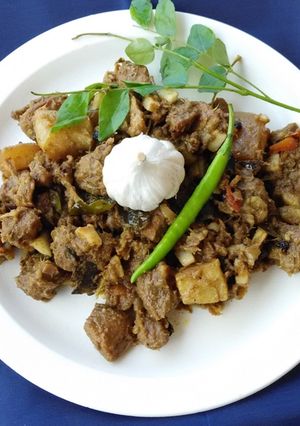 A picture of Pork Dry Masala (Kerala Style).