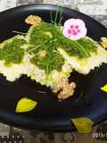 Ravioli di ricotta e spinaci, con pesto di rucola e noci