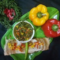 A picture of Masala dosa with bell pepper sabji.