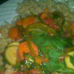 A picture of Noodles and vegetable soup.