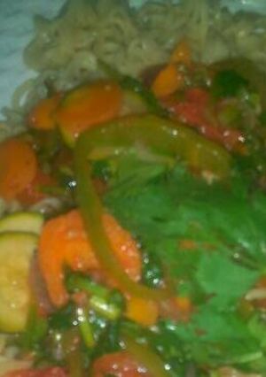 A picture of Noodles and vegetable soup.