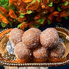 A picture of Jaggery desiccated coconut ladoo.