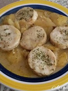 Una foto de Medallones de merluza al vino horneados