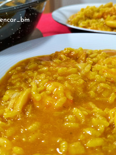 Una foto de Arroz meloso de bacalao y langostinos
