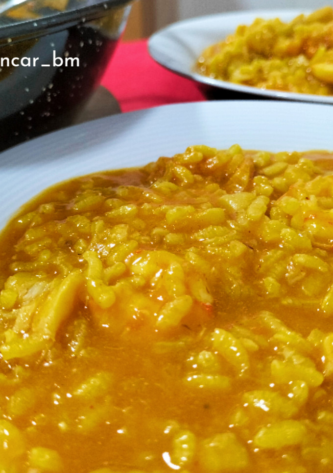 Una foto de Arroz meloso de bacalao y langostinos