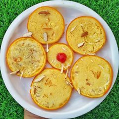 A picture of Orange stuffed kulfi.
