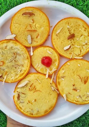A picture of Orange stuffed kulfi.