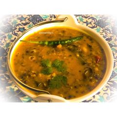 A picture of Kerala Style: Green Moong Dal Curry or Pachai Payaru Kuzhambu.