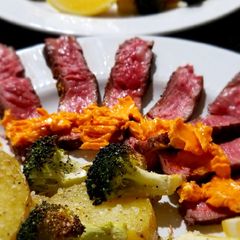 A picture of Chile Butter Steaks with Lemon-Parmesan Broccoli & Potatoes.