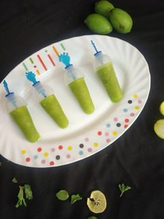 A picture of Raw mango mint popsicles.