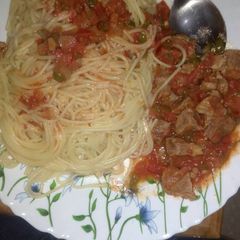 A picture of Spaghetti and wet fried beef.