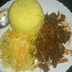 A picture of Tumeric rice and fried liver.