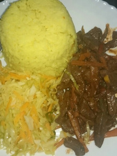 A picture of Tumeric rice and fried liver.