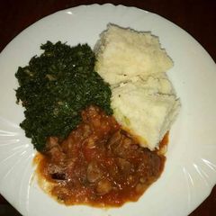 Wet fried beef, kales and ugali A picture of Wet fried beef, kales and ugali.