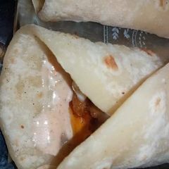 A picture of Cheesy chicken tikka paratha roll.