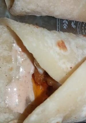 A picture of Cheesy chicken tikka paratha roll.