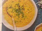 A picture of red lentils with coconut milk
