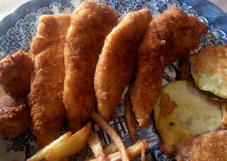 Pechuga de pollo rebozada con guarnición