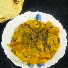 A picture of Rajasthani Papad Pyaz in gravy.