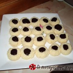 A picture of Coconut macaroons with couverture chocolate.