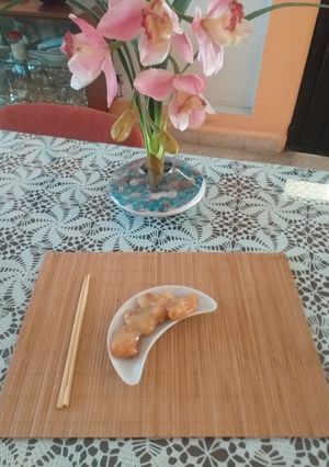 Una foto de Pollo rebozado con salsa de piña