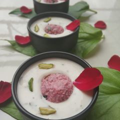 A picture of Paan petha balls and coconut​ rabdi.