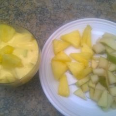 A picture of Fruit salad with vanilla custard.