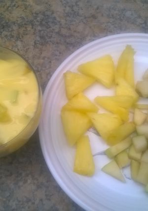 A picture of Fruit salad with vanilla custard.