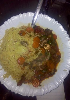 A picture of Indomie with beef stew.