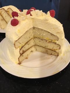 A picture of Vanilla Layer Cake filled withLenon and Rasberry and frosted with Fresh Lemon Cream.