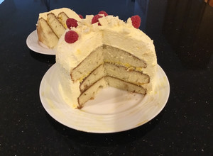 A picture of Vanilla Layer Cake filled withLenon and Rasberry and frosted with Fresh Lemon Cream.