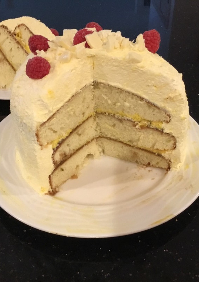 A picture of Vanilla Layer Cake filled withLenon and Rasberry and frosted with Fresh Lemon Cream.