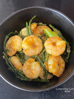 A picture of King Prawns with samphire & lemon butter glaze.