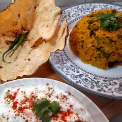 Kathyawadi masala vegetable khichadi with masala curd, papad and 🌶 A picture of Kathyawadi masala vegetable khichadi with masala curd, papad and 🌶.