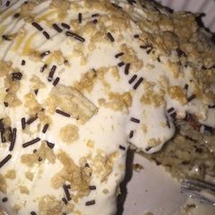 A picture of Oatmeal pancakesTopped with whipped cream and chocolate.