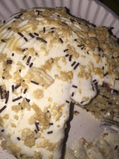 A picture of Oatmeal pancakesTopped with whipped cream and chocolate.