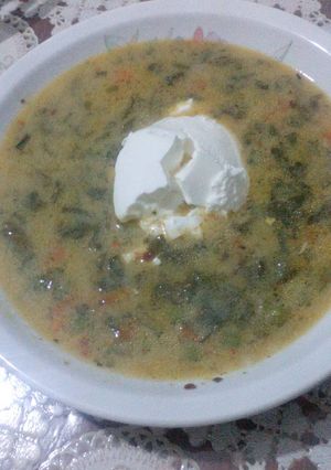 A picture of Vegetarian soup with lots of veggies.