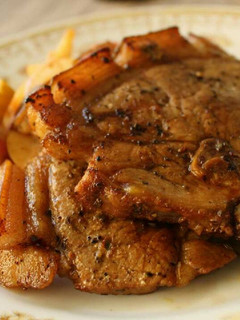 A picture of Grilled Pork Chops with Sauted Apples.
