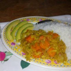A picture of Boiled rice and cabbage served with avocado.