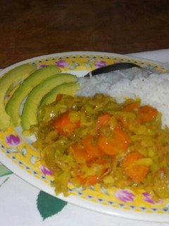 A picture of Boiled rice and cabbage served with avocado.